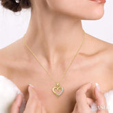 1/10 ctw Round Cut Diamond Heart Shape Journey Pendant in 10K Yellow Gold with Chain